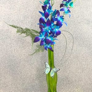 blue flowers in green vase | spring creek designs LLC